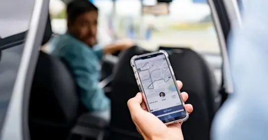 rideshare passenger getting in the car